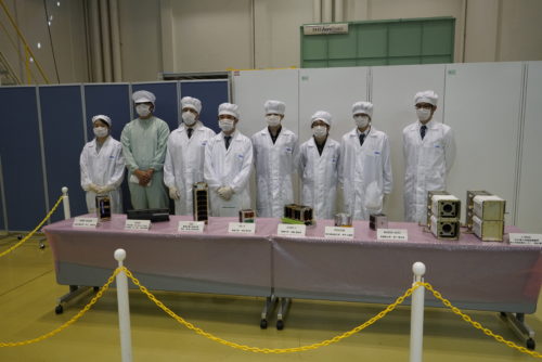 Equipe preparing the satellites to be mounted on the J-SSOD 